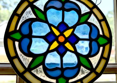 An image of a stained glass ornamental flower in Blue and Yellow | Copper & Light Studio